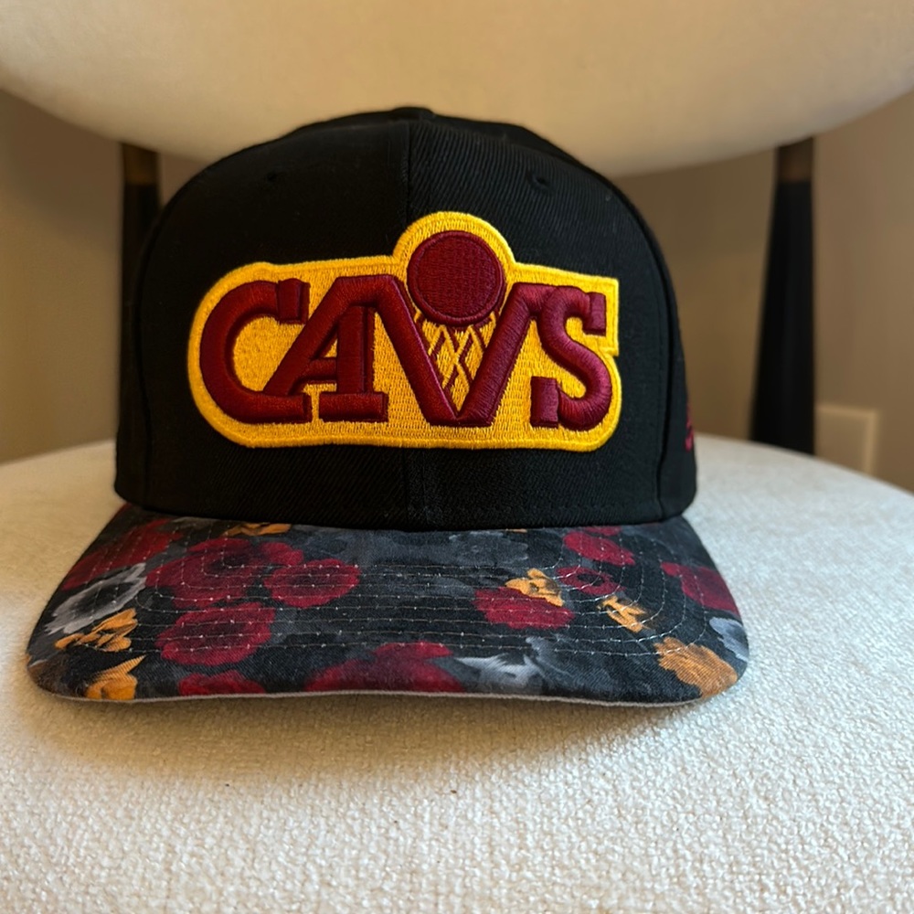 Cleveland Cavaliers “CAVS” baseball cap. Black top with floral brim